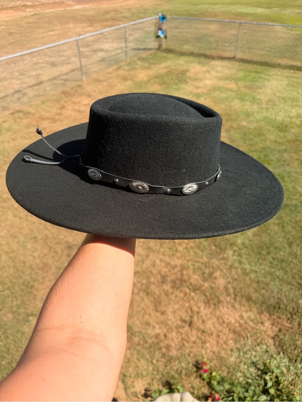 Women’s Black Wide-Brim Felt Western Hat with Concho Band.